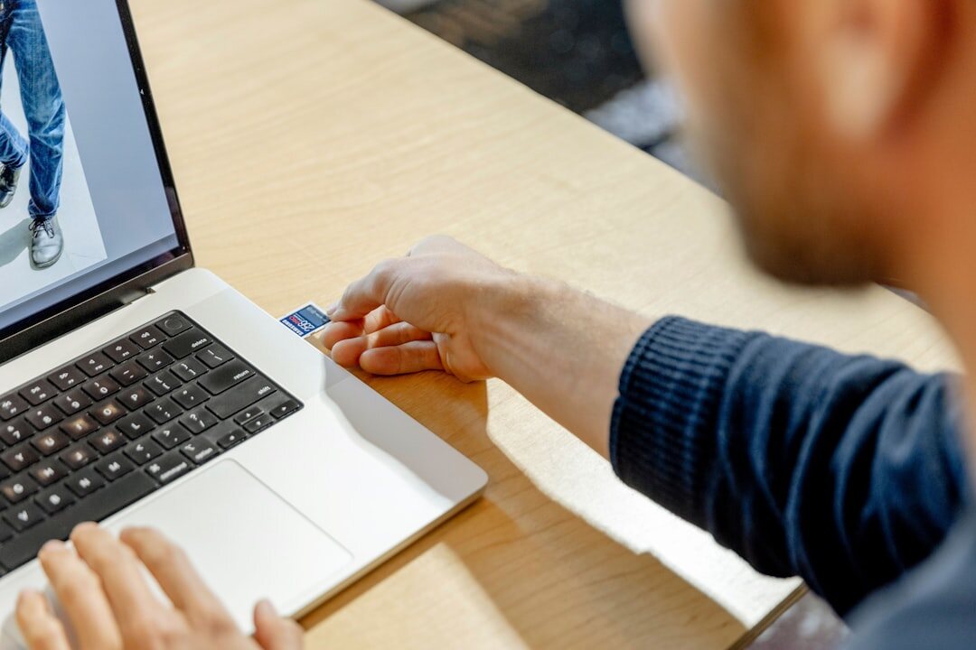 Person analyzing data on a laptop